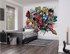 a bedroom with a bed, guitar and wall mural in the corner that is decorated with cartoon characters