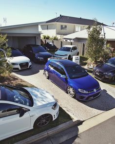 several cars parked in front of a house