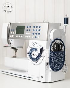 a sewing machine with blue and white designs on it