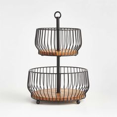 three tiered metal basket with wood accents