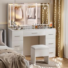 a bedroom with a vanity, mirror and stool next to a window filled with lights