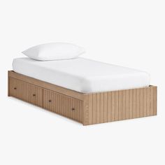 a bed with two drawers underneath it and a white pillow on top of the headboard