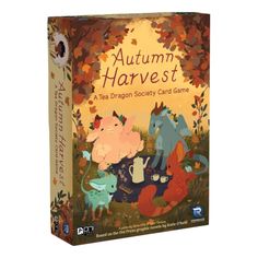 an autumn harvest card game with animals and leaves on the cover, in front of a white background