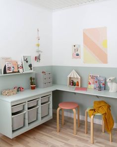 a child's playroom with toys and books on the shelves, along with toy storage bins