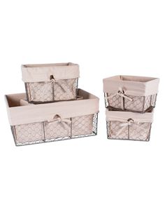 three baskets with bows on them sitting next to each other in front of a white background