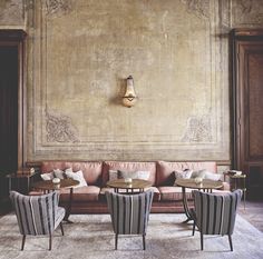 an image of a living room with couches and chairs on the bottom right hand corner