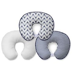 three pillows with blue and white designs on the front, one is shaped like an elephant