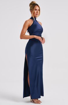 Here's to the nights you will remember because of the fits you won't forget. You will be unforgettable in Etta, our luxe maxi made from bias cut satin that skims beautifully over the body. The dress is completely backless with a high neck and an oversized tie neck detail. Elevate any look with Etta, platform heels and a sleek knot.


Colour: Navy.

Luxury bias cut satin.

High neckline.

Backless detail.

Skims over the figure.

Flares gently at the hem.

Maxi length.

Model is an XS and is wear Guest Ideas, Homecoming Dresses Corset, Be Unforgettable, Midi Dress Wedding Guest, Long Sleeve Homecoming Dresses, Navy Blue Maxi Dress, Dresses Flowy, The Nights, Homecoming Dresses Long