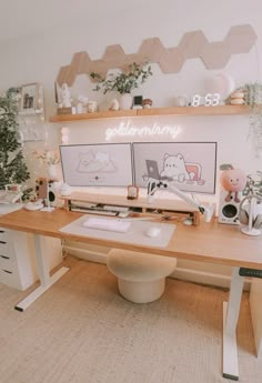 a wooden desk topped with two computer monitors next to plants and potted planters