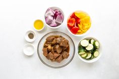 the ingredients are laid out in bowls on the table