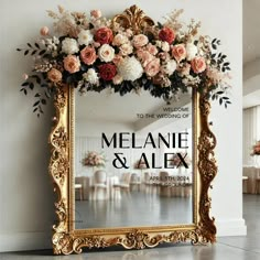 an ornate gold frame with flowers on the front and back is featured against a white wall