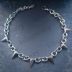 Punk/grunge style chunky spike rivet choker necklace in silver! Unisex. Chain is made from stainless steel.  Spike rivets are made of copper and measure  Available in 3 different sizes: Small ( shown in photographs) Measures 14 inches + 3 inch extension chain  Medium  Measures 16.5 inches + 3 inch extension chain  Large  Measures 19 inches + 3 inch extension chain  Small necklace comes with 6 spikes, Medium with 8 spikes and large with 10 spikes. Please don't hesitate to contact me with any quer Punk Choker With Spikes, Punk Style Silver Choker For Festivals, Rock Style Jewelry Choker For Alternative Fashion, Rock Style Choker Jewelry For Alternative Fashion, Rock Style Choker For Alternative Fashion, Silver Emo Style Necklace For Festivals, Silver Emo Necklace For Festival, Gothic Spiked Choker For Festivals, Rock Style Spiked Jewelry For Parties