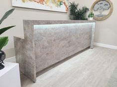 an office with a concrete reception desk