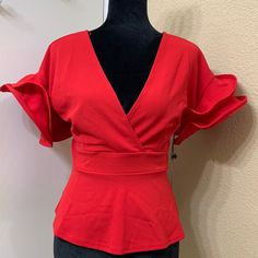 Haute Monde Raffle Sleeve Blouse .Excellent Pre-Owned .Excellent Condition No Holes Or Flaws .With Tag Approximate Measurements .Length 22” .Shoulder 20” .Bust 17” Elegant Red V-neck Blouse, Chic Formal Tops With Ruffle Sleeves, Fitted Ruffle Sleeve Top For Evening, Fitted Ruffle Sleeve Evening Tops, Fitted Top With Ruffle Sleeves For Evening, Formal Fitted Top With Ruffle Sleeves, Spring Evening Tops With Ruffle Sleeves, Red Fitted Top For Formal Occasions, Elegant Fitted Red Top