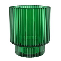 a green glass vase sitting on top of a table