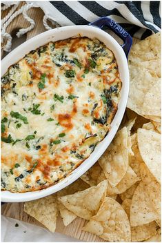 spinach dip with tortilla chips on the side