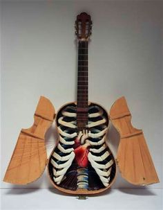 an acoustic guitar with the skeleton and ribs visible