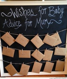 a chalkboard with notes attached to it that says wishes for baby advice for mums