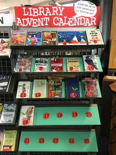 there is a book shelf with many books on it in the library and an advertising sign