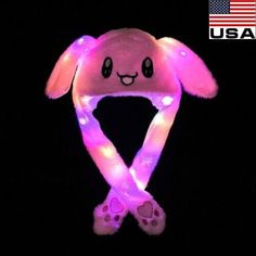 a stuffed animal with lights on it's head and paws in the shape of a bunny