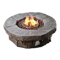 an outdoor fire pit with rocks around it