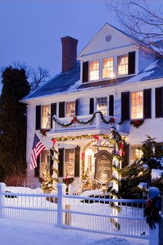 a large white house with christmas decorations on it