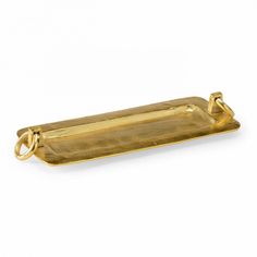 a gold rectangular tray with handles