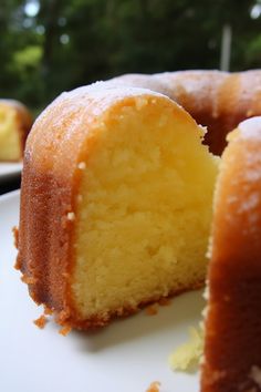 a close up of a cake on a plate with one slice missing from the cake