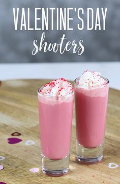 valentine's day shooters with sprinkles and whipped cream in glasses on a wooden table