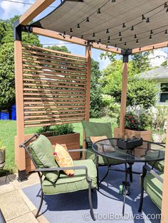 an outdoor patio with chairs, table and lights on the pergolated roof area