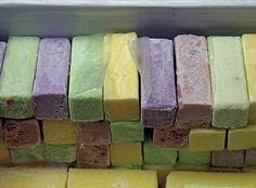 there are many different colored bars of soap