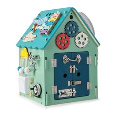 a green toy house with gears on it