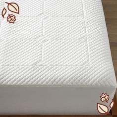 an image of a mattress with leaves on it