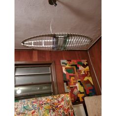 a ceiling fan that is hanging from the ceiling