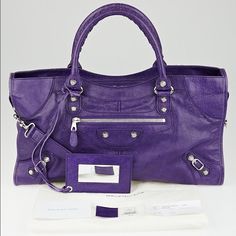 Balenciaga Crocus Part Time Bag Has A Chic Shape That Is Made Of Distressed Purple Lambskin Leather With Silvertone Mini Giant 12 Hardware. Detachable Shoulder Strap, Matching Mirror. The Exterior Leather Shows Wear Along The Side Piping Which Has Faded. The Handles Show Indentations At The Bases From Resting Against The Hardware. The Hardware Has Minor Hairline Scratches But Is Still Crisp And Bright. The Interior Shows Light Staining Throughout But Is Still Clean And In Good Condition Overall. Purple Leather, Part Time, Balenciaga City Bag, Lovely Colors, Lambskin Leather, Piping, Balenciaga, Athletic Shoes, Satchel