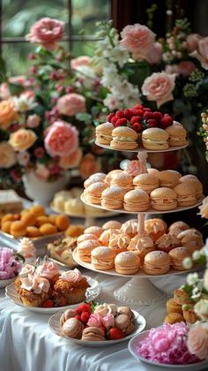 a table topped with lots of different types of pastries and desserts on top of plates