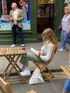 reading books in London cafes street solo coffee date green corduroy trousers pants cardigan fall fashion summer fashion aesthetics aesthetic vibes blonde brown wavy hair highlights Street Date Aesthetic, Reading At A Cafe Aesthetic, Taking Yourself On A Date Aesthetic, Reading At A Cafe, Coffee Outside Aesthetic, Solo Coffee Date Aesthetic, Date With Myself Aesthetic, Reading Date Aesthetic, Reading In Coffee Shop