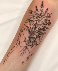 a woman's arm with flowers on it and the words, i love you