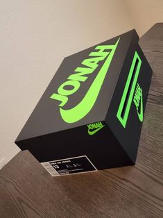 a nike box sitting on top of a wooden table