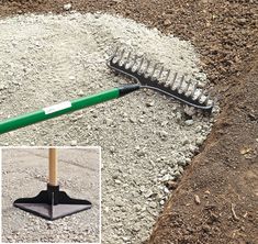 a shovel and rake laying on the ground next to some dirt with gravel around it