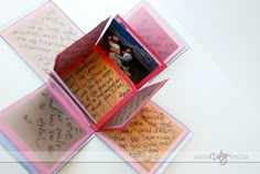 an open card box with writing on it and the words exploding love in red ink