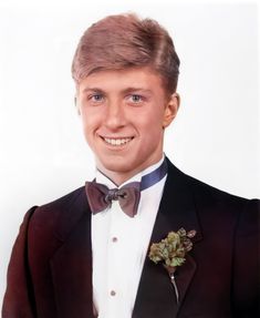 a young man in a tuxedo and bow tie