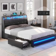 a bed with blue light under it in a living room next to a couch and chair