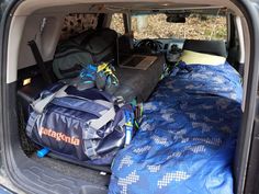 there are many bags and luggage in the back of this van, but it's not too big