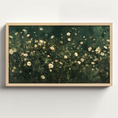 a painting hanging on the wall with white flowers