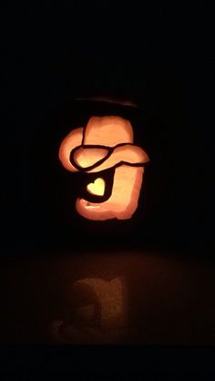 a pumpkin carved to look like the letter g