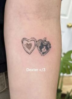 two heart shaped tattoos on the arm with words dexter and 3 written below them in black ink