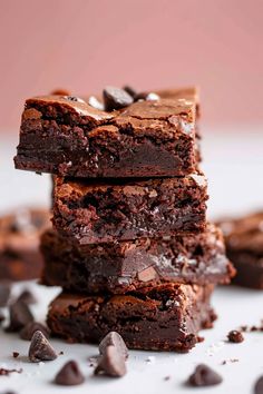 three chocolate brownies stacked on top of each other