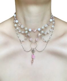 Dreamy Darling Necklace 🌸 Add a touch of sweetness and whimsy to your look with this coquette draped necklace made using faux pearls, acrylic beads, and glass beads in shades of pink and white with hearts and butterflies. 🌸 This necklace is perfect for any occasion, from a casual day out to a special event. The delicate chain drapes beautifully around your neck, and the beads sparkle and catch the light with every move. The hearts and butterflies add a touch of girly charm and romance. 🌸 Only one available as I like to make one of a kind pieces so that you have a unique, standout, rare, special piece that you can't find anywhere else. Care Instructions: Keep your jewellery away from water, oils, perfumes and make sure to remove before showering and sleeping in order to keep it in it's b Hearts And Butterflies, Geometric Mirror, Winter Inspired, Delicate Chain, Choker Necklaces, Acrylic Beads, Shades Of Pink, Pink And White, Faux Pearl