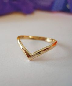 Hammered Chevron Ring | V Shape Curved Wedding Band | Minimalist Chevron Rings | Chevron Stacking Rings | Promise Rings | All ring sizes This ring is handcrafted from 14k gold filled half round wire. It is hammered to bring out the high gloss shine. Chevron rings can be versatile accessories, suitable for everyday wear or special occasions, depending on their design and materials. They are often chosen for their stylish and modern appearance, and they can complement a wide range of personal styl V Shape Ring Design, Chevron Ring Wedding, Chevron Ring Stack, V Shape Ring Gold, Chevron Gold Ring, V Shape Ring, Gold Chevron Ring, Rings Promise, Friendship Day Gifts